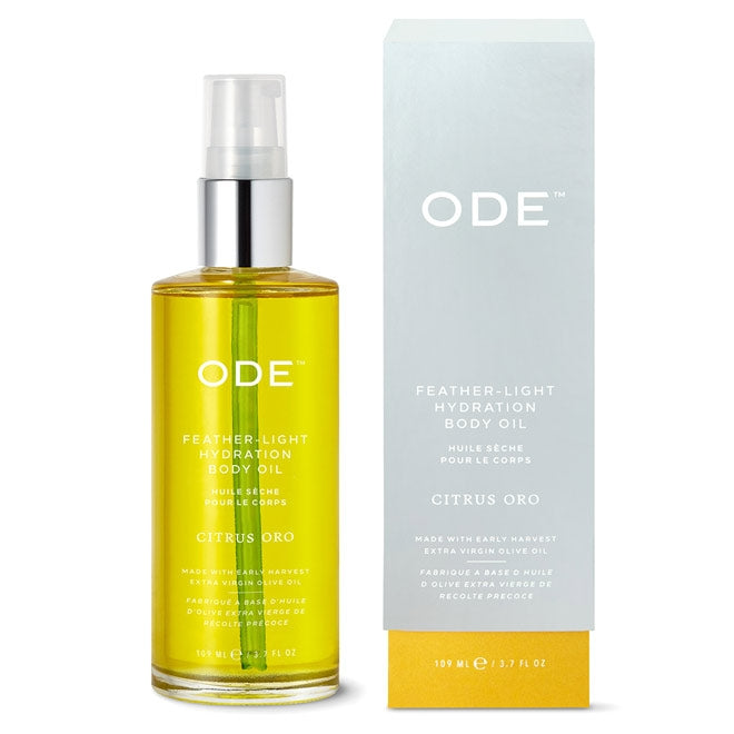 citrus body oil in a bottle