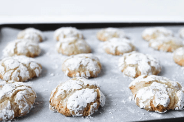 Gingerbread Olive Oil Crinkle Cookies on a tray fresh from the oven