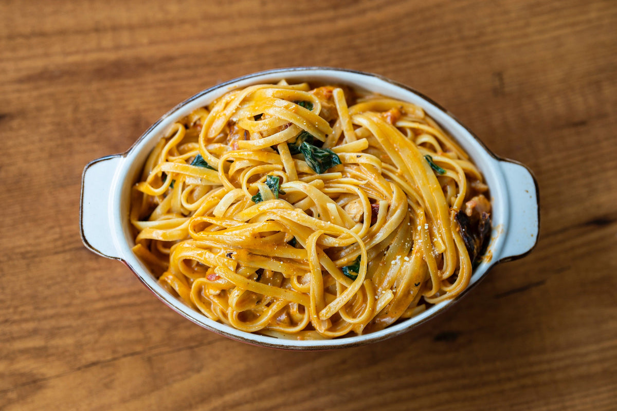 A large bowl of crab pasta as seen from above